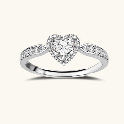 Complete jewelry set with heart-shaped sterling silver pieces featuring brilliant moissanite stones on white background.