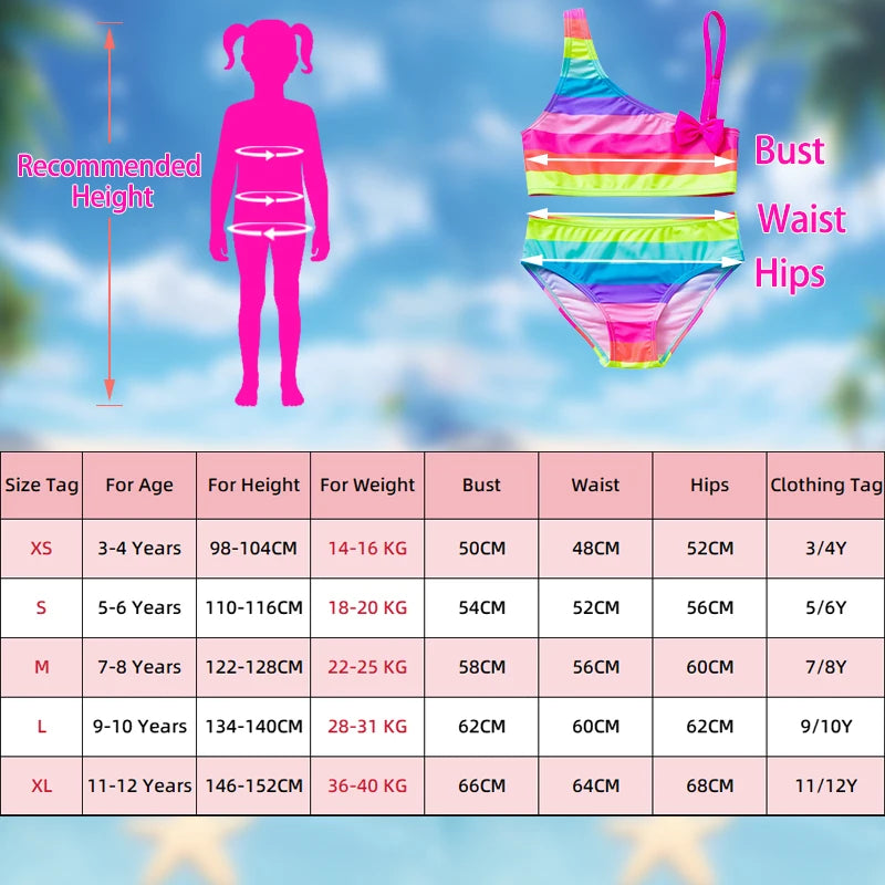 Two-piece rainbow striped girl's swimsuit featuring a golden crown 'Queen' graphic and a pink decorative bow.