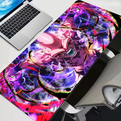 Dragon Ball Z Kid Buu XXL gaming mouse pad on a desk with a laptop and gaming chair showing the vibrant anime print.