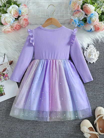 Back view of the purple ribbed knit dress showing the ruffle shoulders and layered gradient tulle.