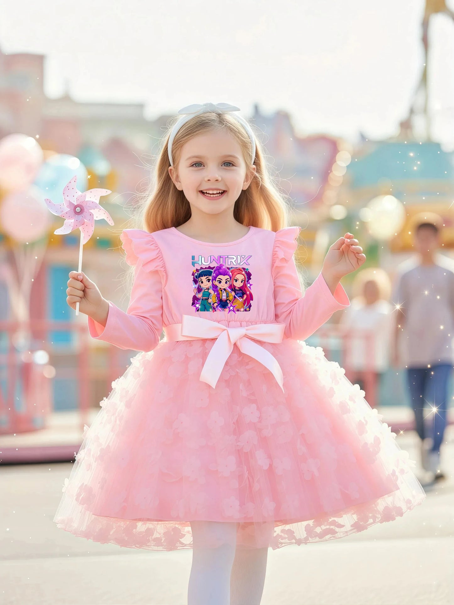 Young girl in a pink long-sleeve K-Pop HUNTRX dress with 3D butterfly appliques on a tulle skirt.
