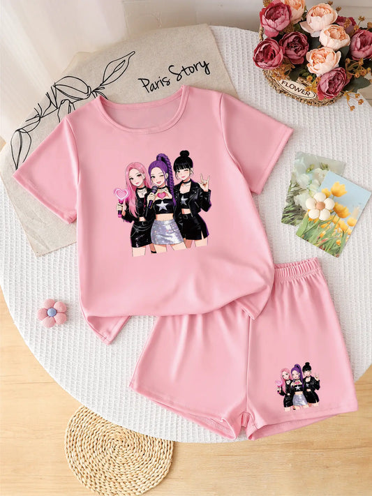 Flatlay of a trendy pink 2-piece girls' outfit featuring a K-POP idol group graphic on the t-shirt and shorts.