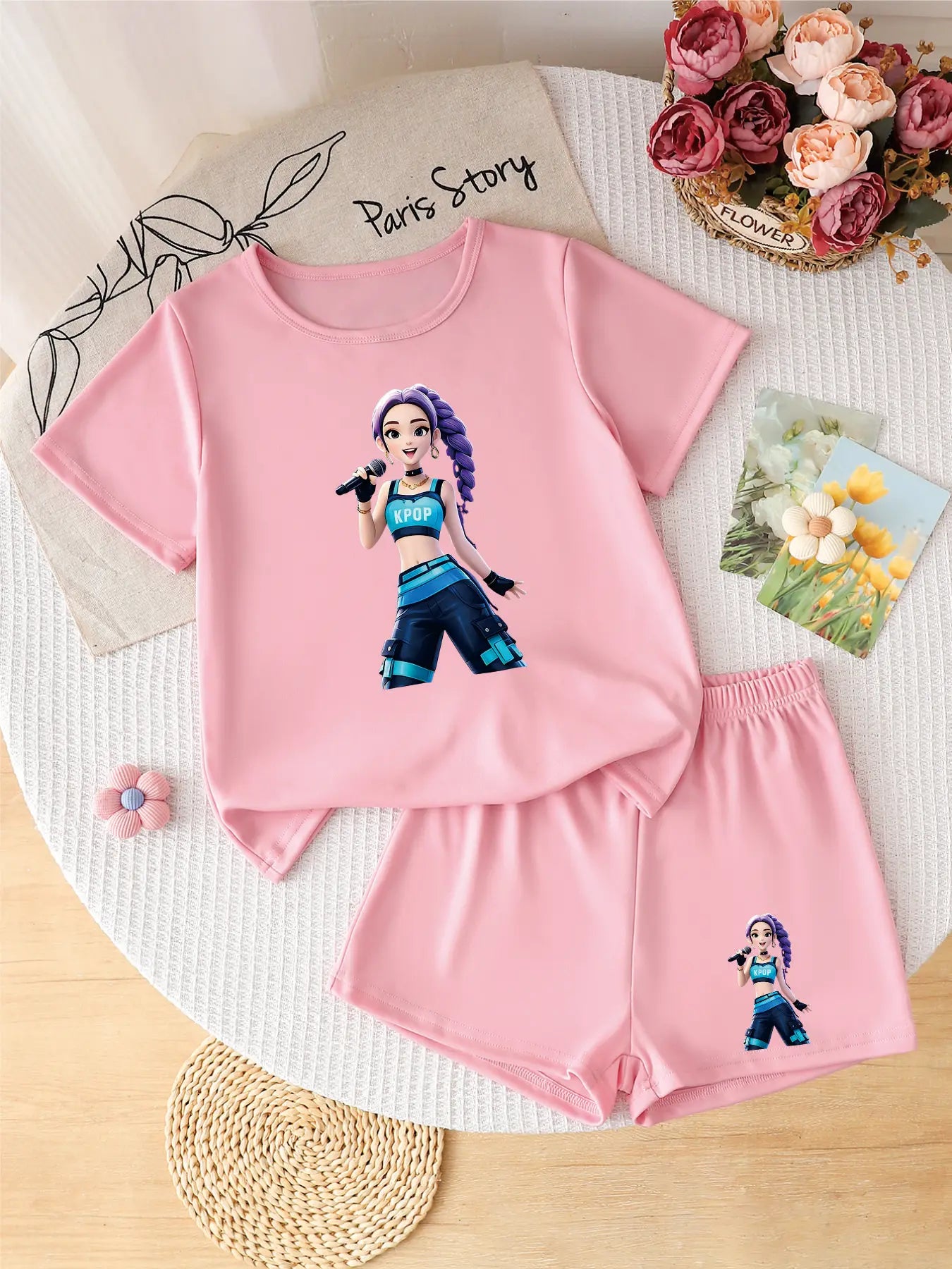 Two-piece pink girls' summer set featuring a purple-haired K-POP soloist graphic on the t-shirt and shorts.