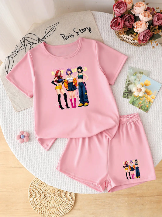 Two-piece pink girls' summer set featuring a colorful street-style K-POP idol group graphic on the shirt and shorts.
