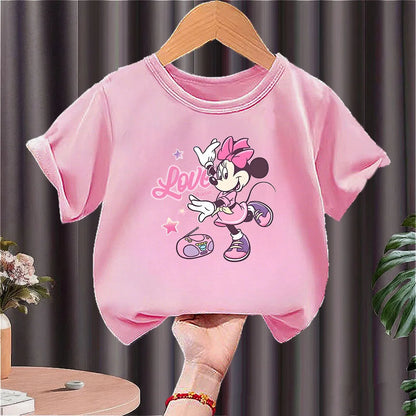 Pink girls' short-sleeve t-shirt featuring a dancing Minnie Mouse with stars and 'Love Music' text.