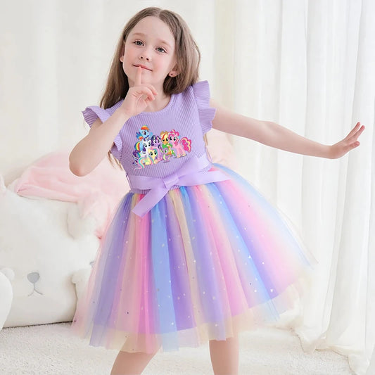 Young girl in a lavender My Little Pony princess dress with a rainbow sequined tulle skirt and a satin waist bow.