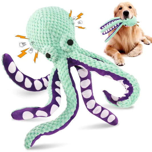 A Golden Retriever and a Cavalier King Charles Spaniel playing with the green squeaky octopus plush toy.