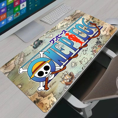 Vintage nautical One Piece world map XXL gaming mouse pad on a modern white desk setup.