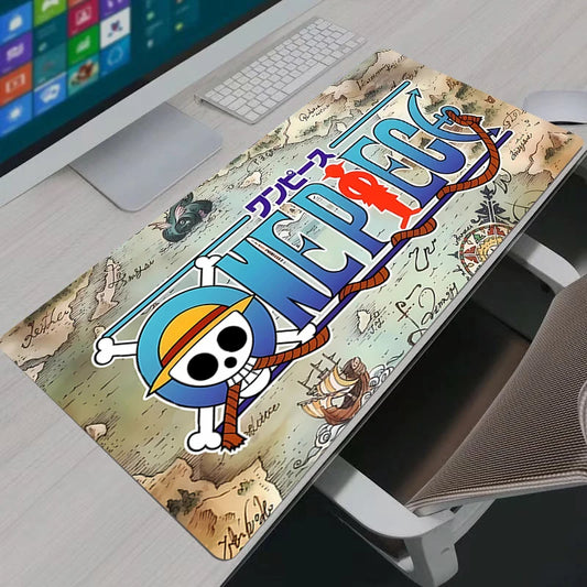 Vintage nautical One Piece world map XXL gaming mouse pad on a modern white desk setup.