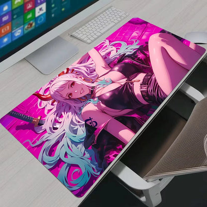 Vibrant neon pink Yamato One Piece XXL gaming mouse pad on a modern white desk setup.