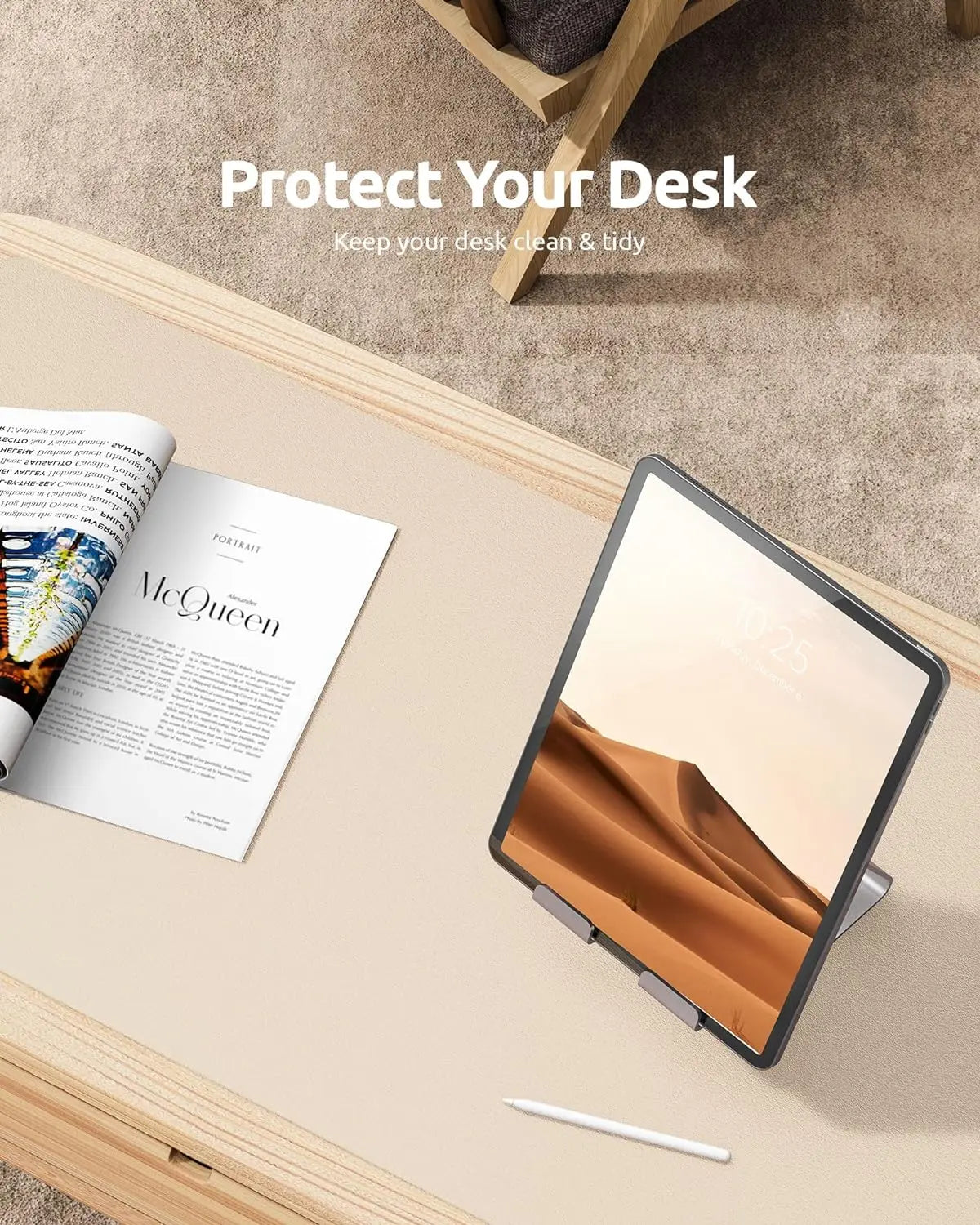 Cream-colored YSAGi leather desk mat protecting a wooden desk with an iPad and a fashion magazine.
